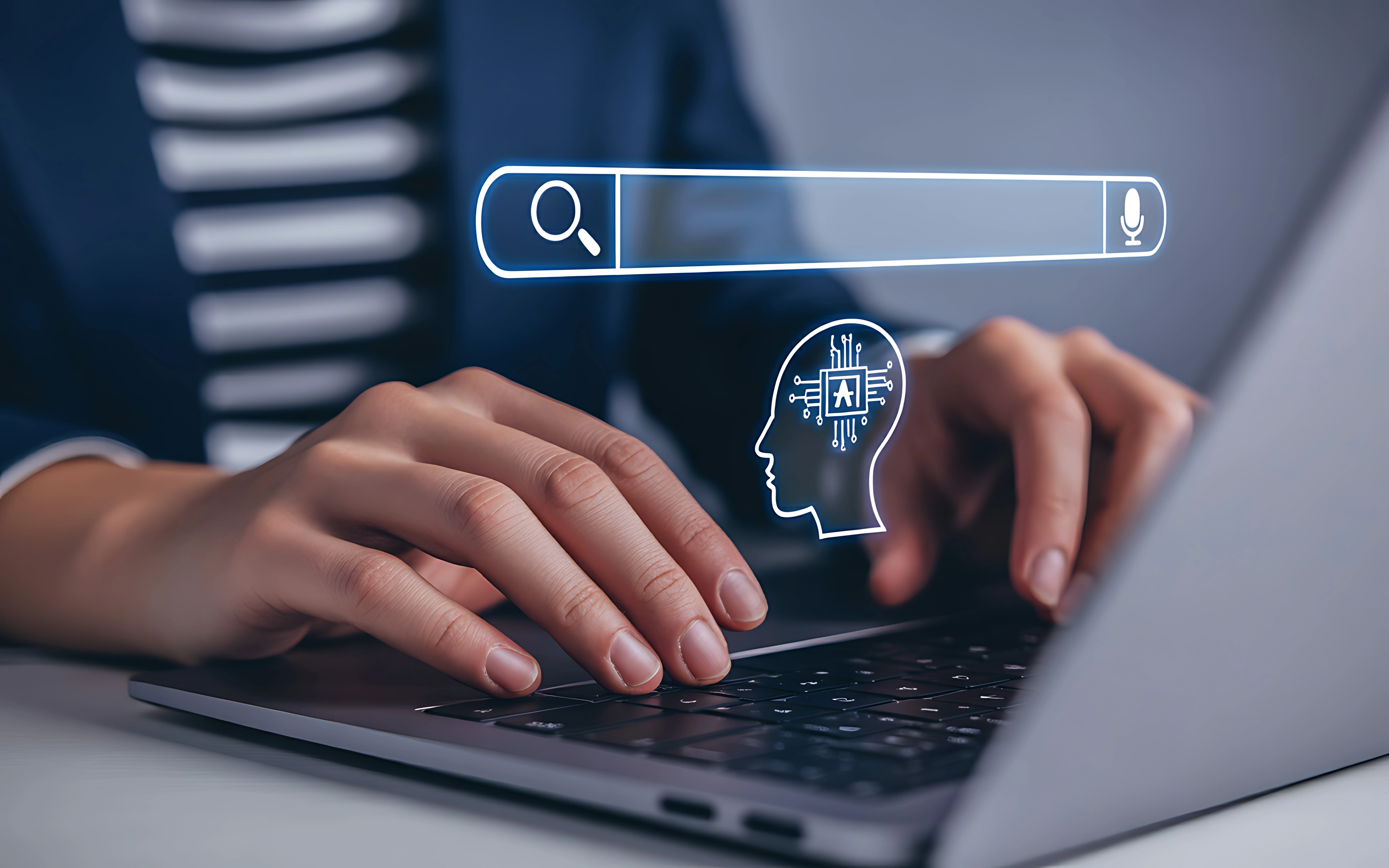 Persona escribiendo en un portátil junto a una barra de búsqueda y un icono de inteligencia artificial